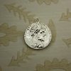 silver stylised coin charm
