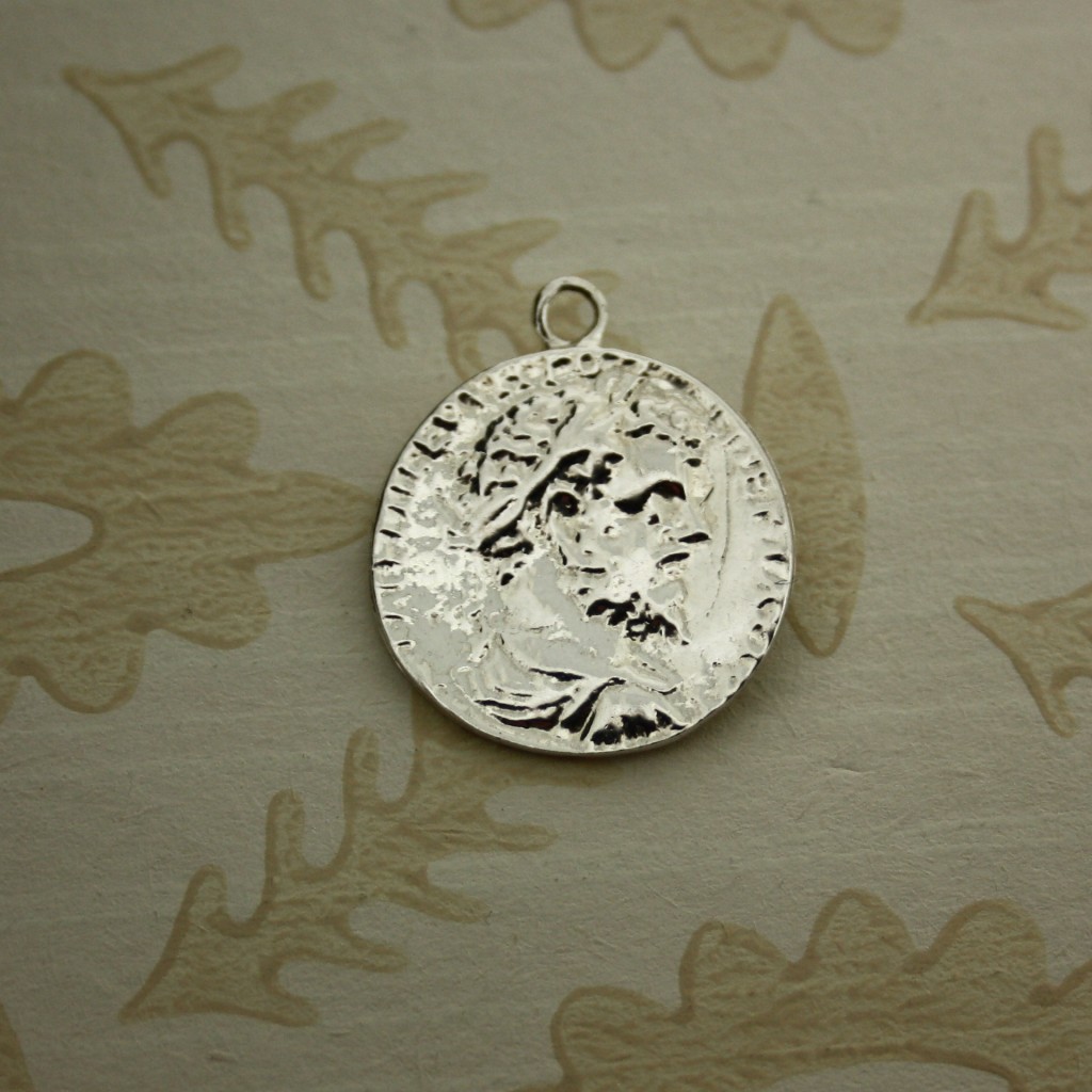 silver stylised coin charm