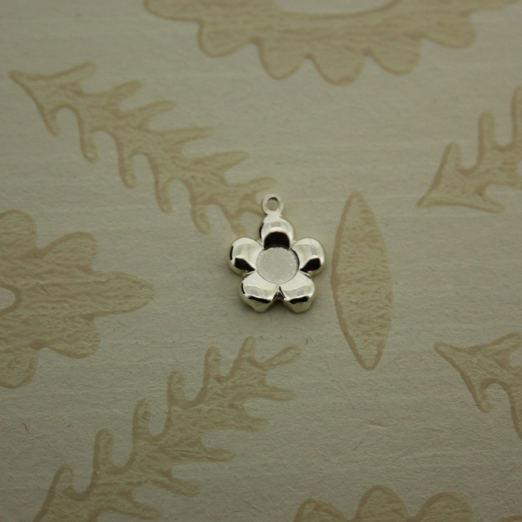 small silver flower charm