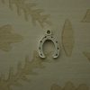 small silver horseshoe charm