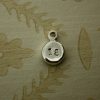 Flat, round nugget hand stamped with number 18