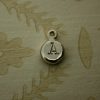 Round silver nugget hand stamped with an initial letter