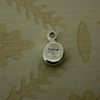 silver pebble hand stamped with skull and crossbones symbol