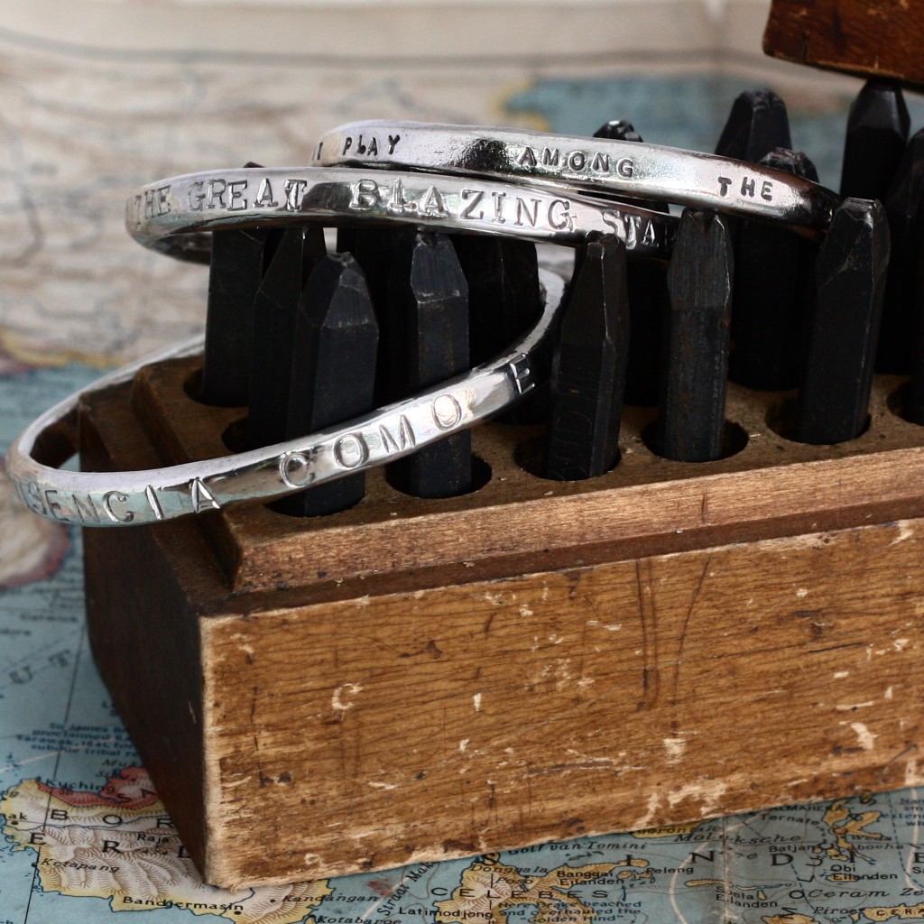 A personalised chunky sterling silver bangle, hand stamped