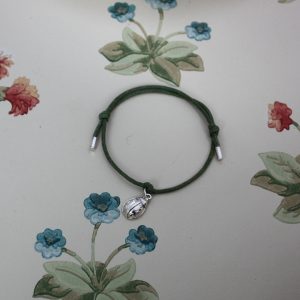 Silver ladybird charm on a cord friendship bracelet