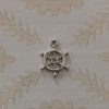 silver ship's wheel charm